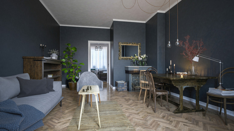 Interior of a living room with a dark color palette