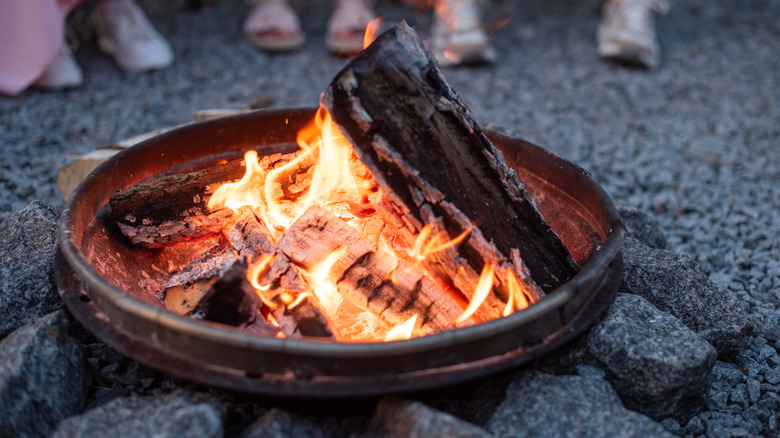 fire pit surrounded by gravel
