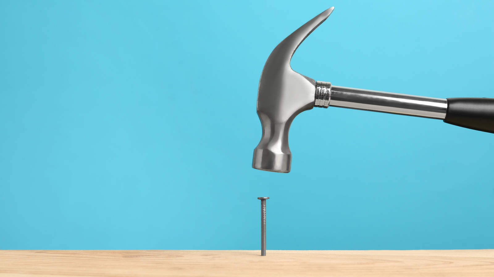 Hammer and nails on wooden background, wood and rust head iron hammer lying  on wooden board with outdoor workshop. 10406741 Stock Photo at Vecteezy