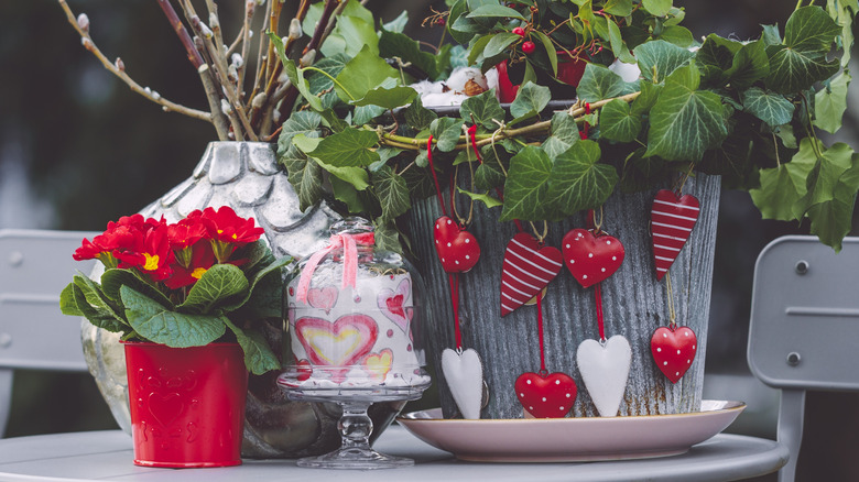 Valentine's day-themed decor items on a patio table
