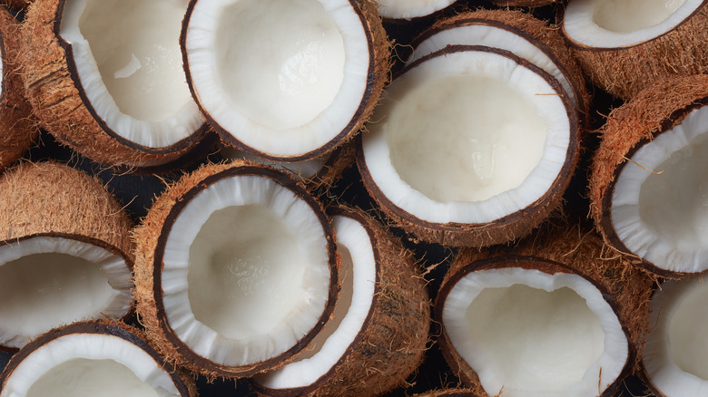 Closeup of opened coconuts showing white insides