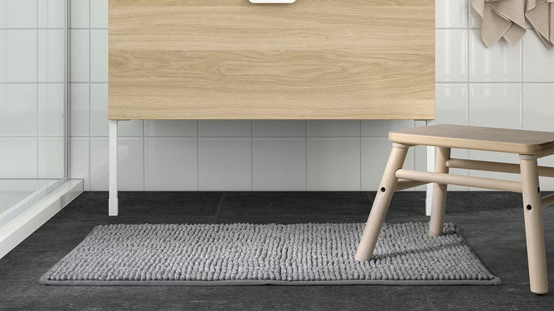 IKEA gray plush bath mat under bathroom vanity