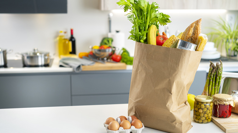 bag of groceries sitting on a kitchen counter