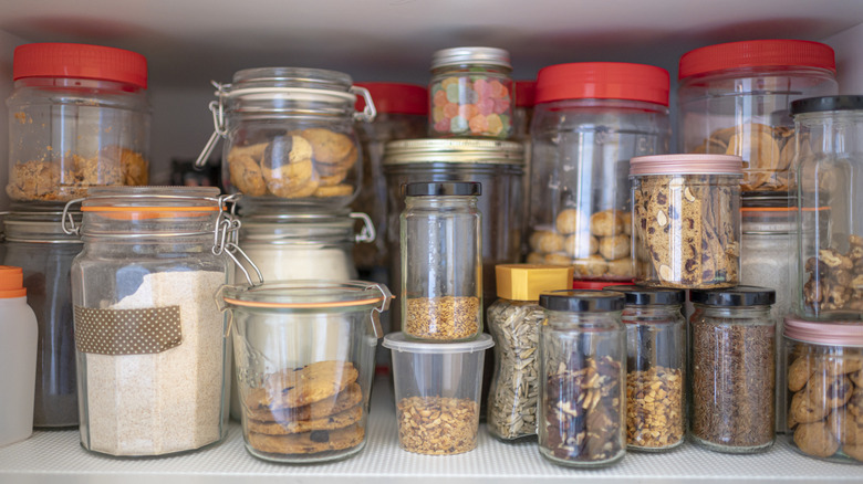 Jars of food and spices in a cabinet