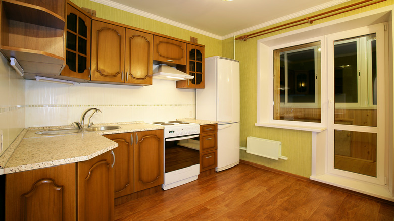 Kitchen featuring orange wood cabinets