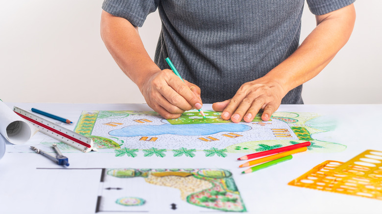 A landscape architect planning a backyard