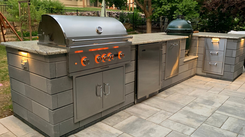 A built-in BBQ with an outdoor kitchen