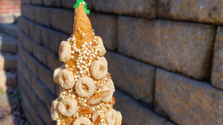 A homemade bird feeder using an ice cream cone.