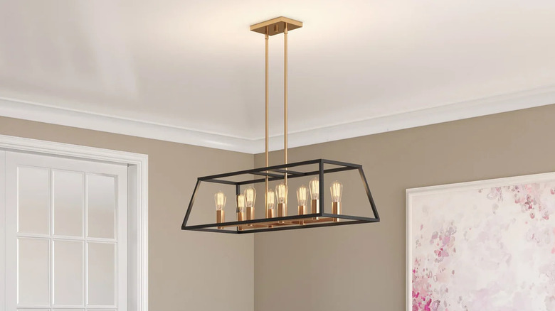A Carter Long Pendant By Artika over a dining table