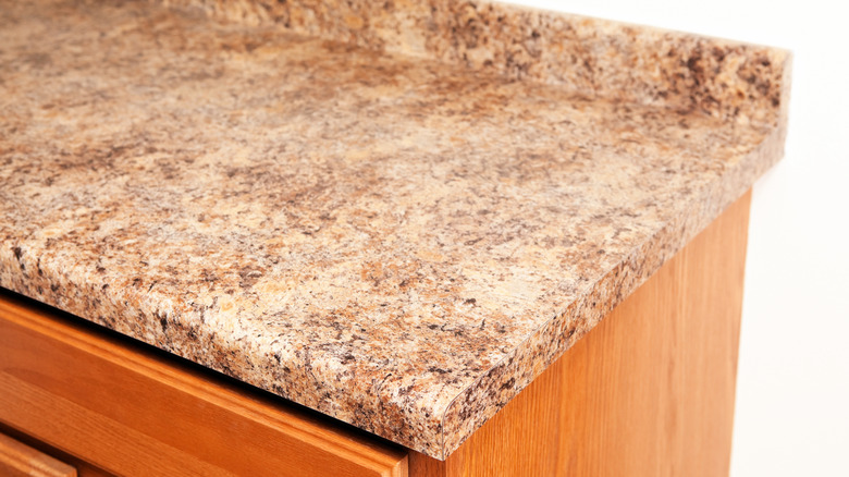 closeup on countertop made of laminate resembling granite stone