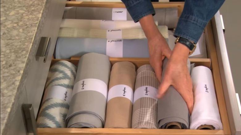 Rolled napkins in a drawer