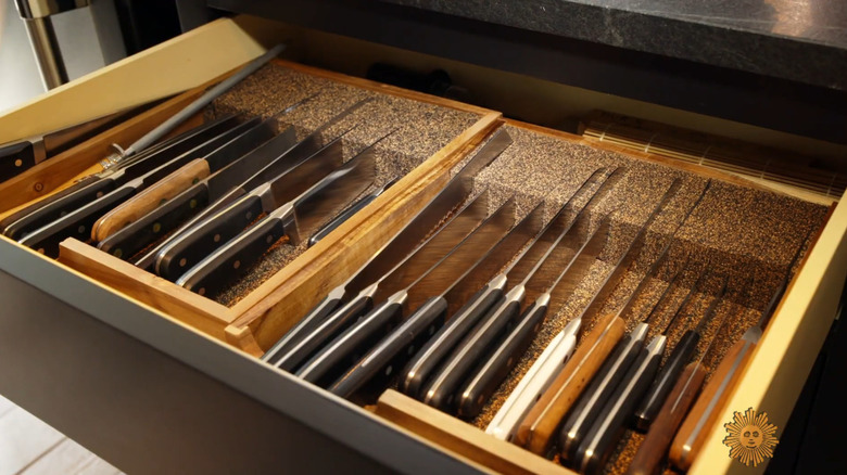 A knife drawer organized with cork