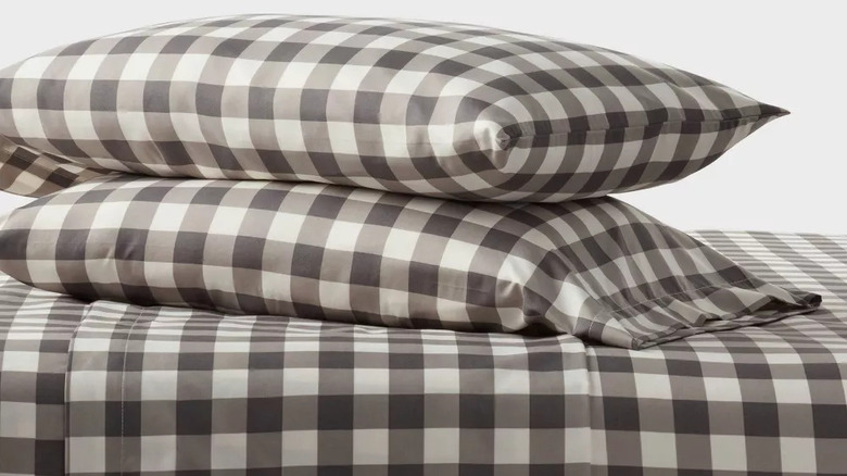 Target microfiber sheet and pillowcases in gray plaid against a white background
