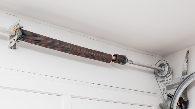 Rusty, broken spring on garage door
