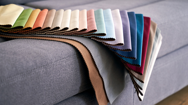 Fabric samples lying on top of a couch