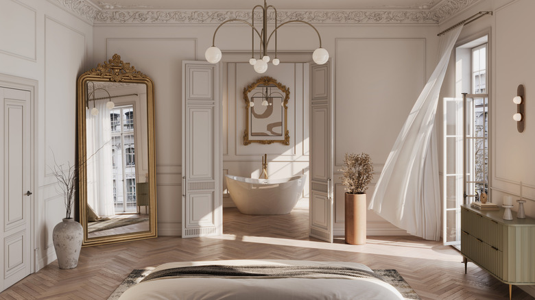 Large bedroom with a tall leaning mirror in the corner