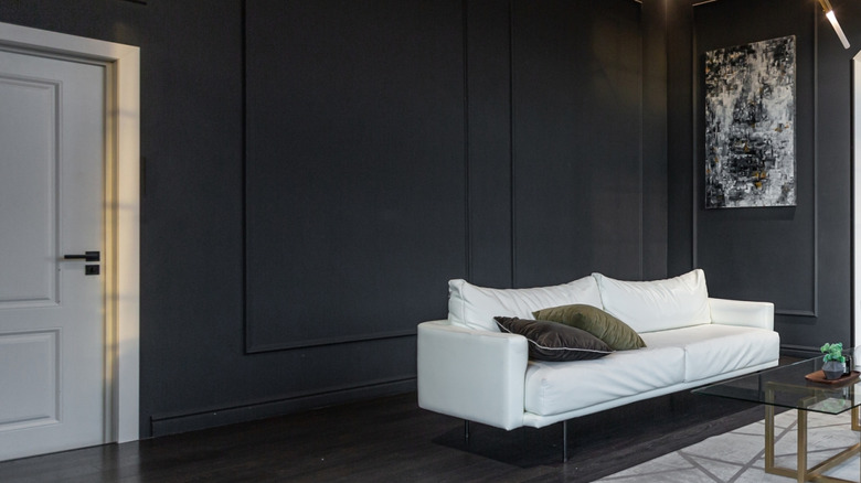 Black painted walls of a large living room
