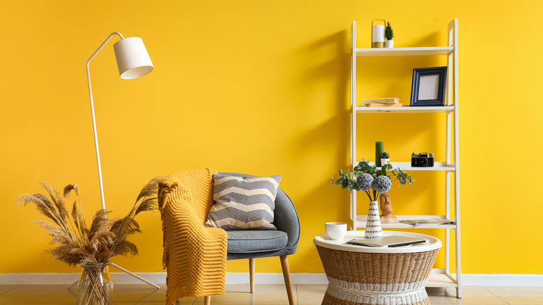 Bright yellow paint in minimally-furnished room