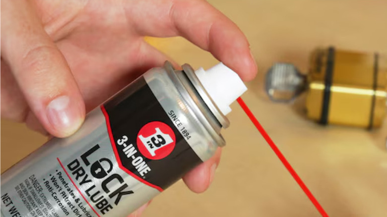 Using lubricant spray on door lock