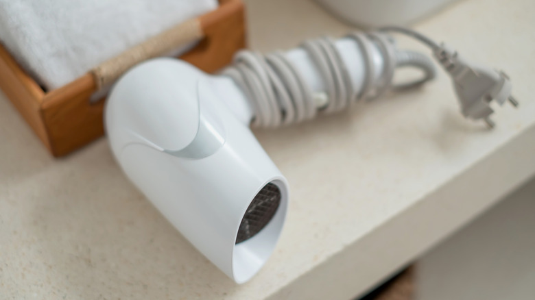 Hair dryer on bathroom counter