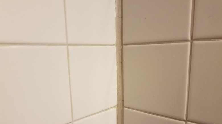cracked caulk in the corner of shower