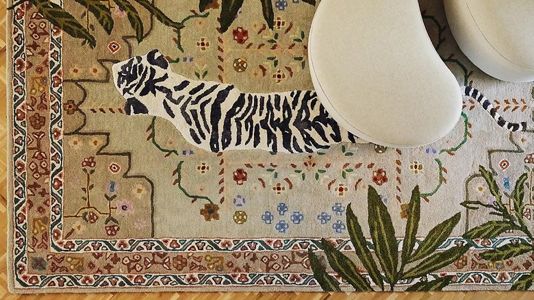 Anthropologie area rug with a tiger and botanical print