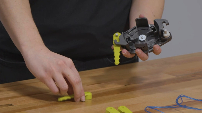 A woman assembling the fixed line.