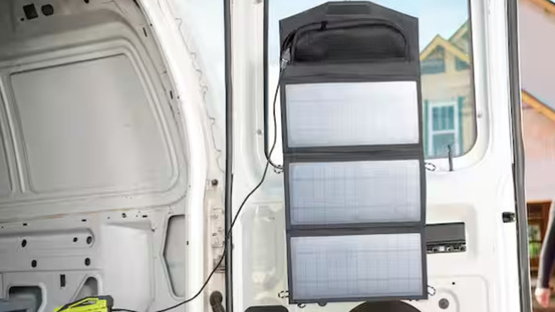The RYOBI solar panel hanging in a van.
