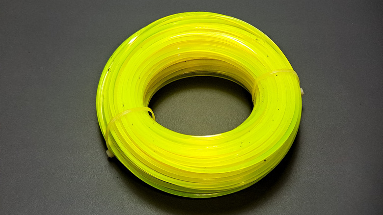 A yellow spool of trimmer line.