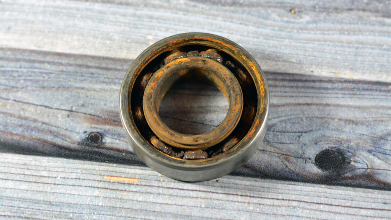 A photograph of a damaged bearing from a washing machine.