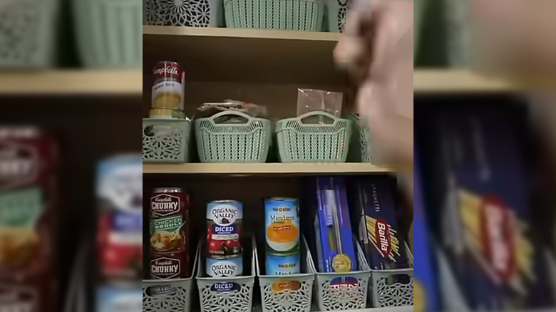 book bins holding canned goods and pasta in pantry