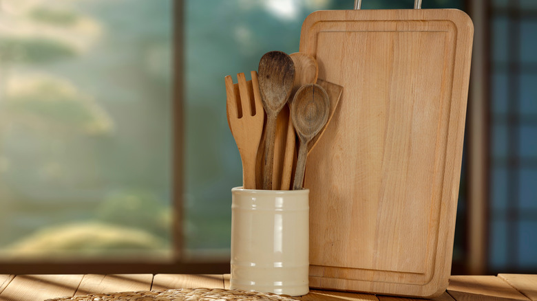 Wooden spoons in a white vase