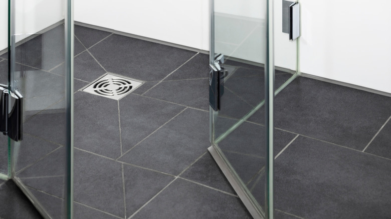 Closeup of modern shower and shower drain