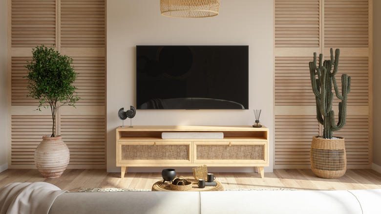 Living room in neutral colors with a tv and media console