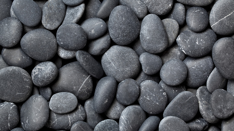 Close up of dark gray pebbles