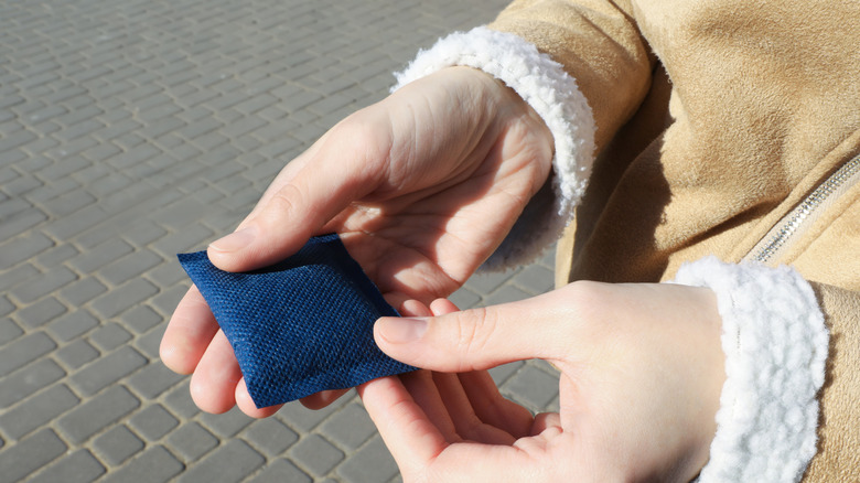 Close up of woman holding hand warmer