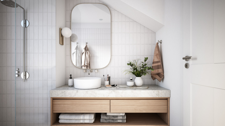 Large mirror in small bathroom