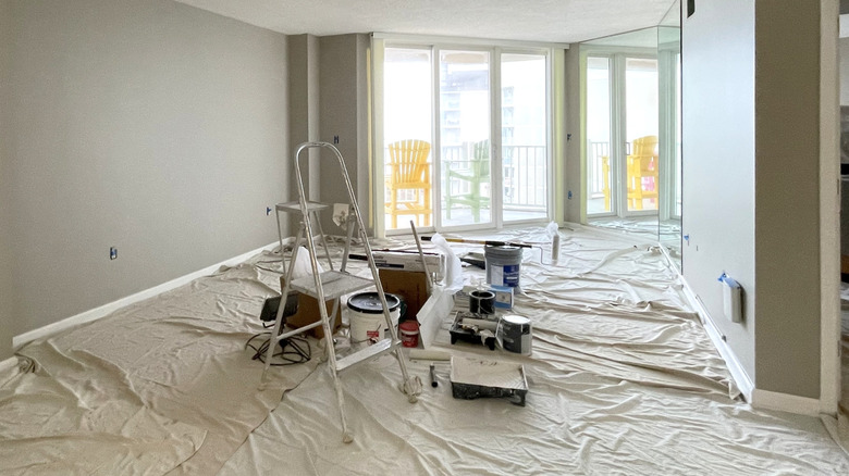 Room prepped for painting with drop cloths