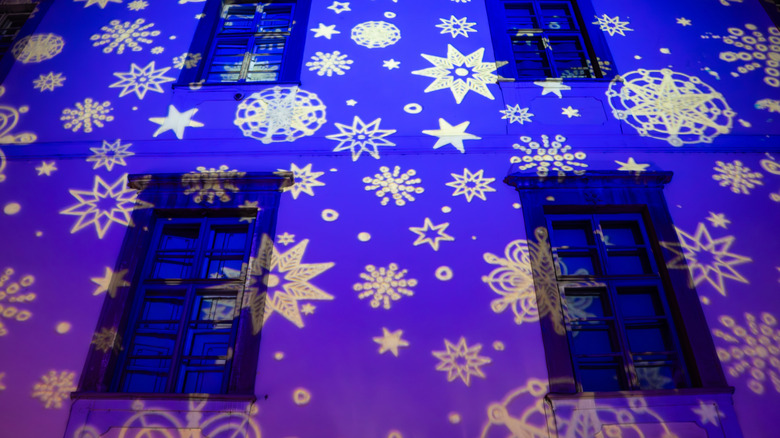 Projected snow flakes on house