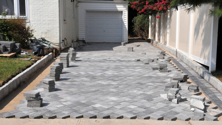 Driveway pavers being installed in a diagonal pattern