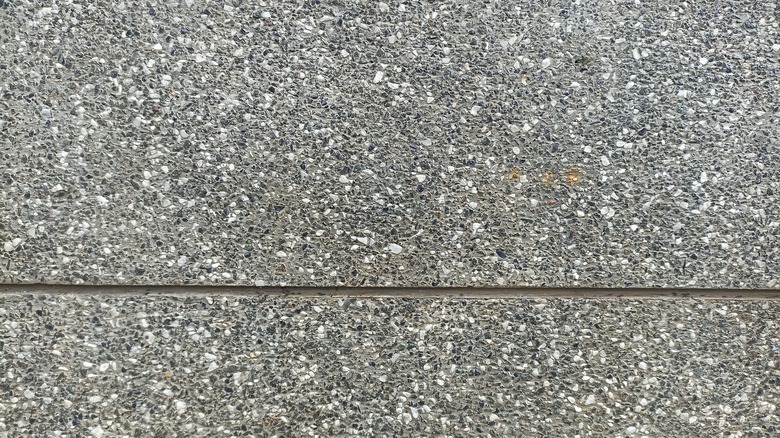 An up close view of exposed aggregate concrete texture