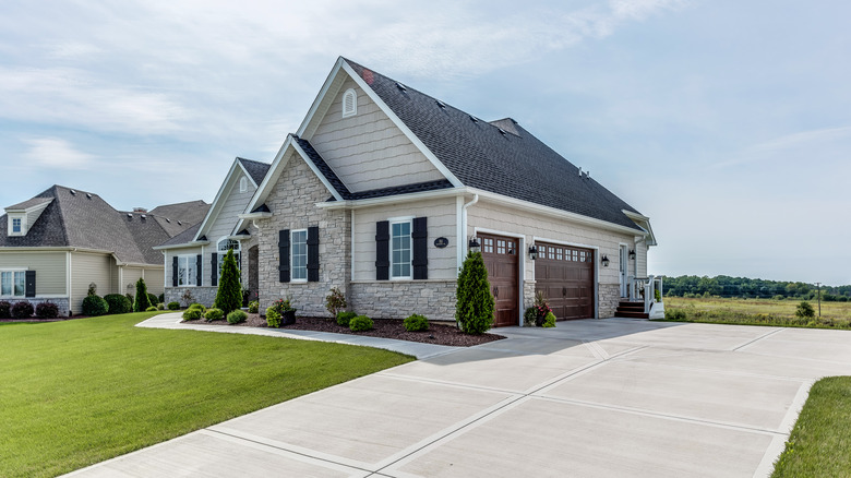 A home with wide concrete driveway