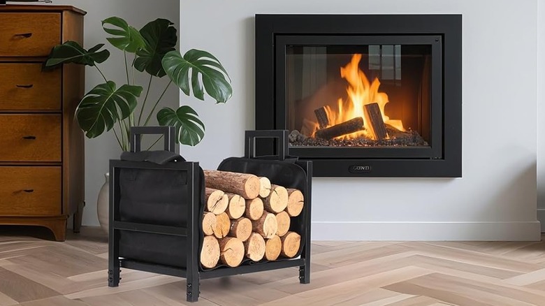 A firewood rack with a portable liner carrier.