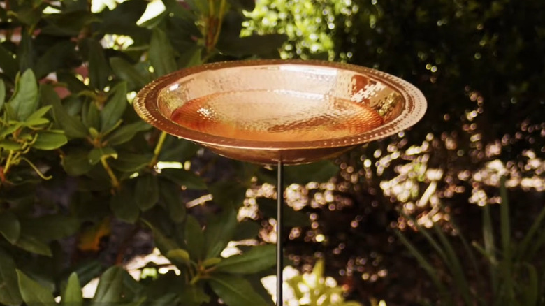 Hammered copper basin bird bath