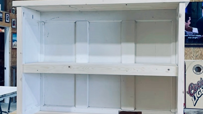 Small shelving unit built from two old panel doors.