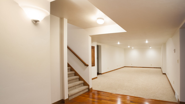 Finished basement with cream walls