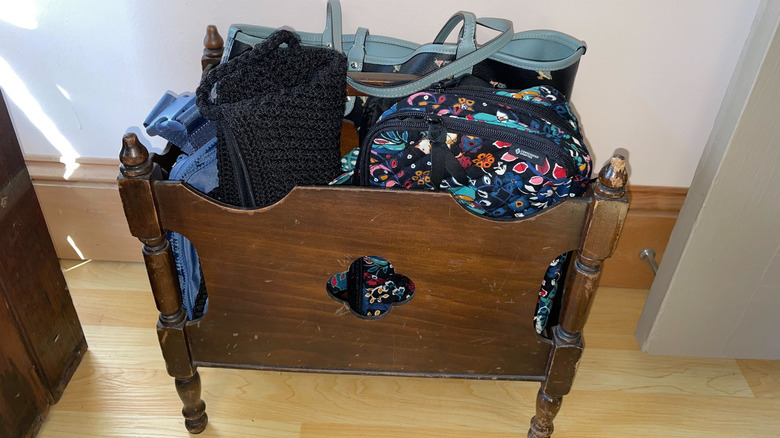 Purses and handbags in a magazine rack