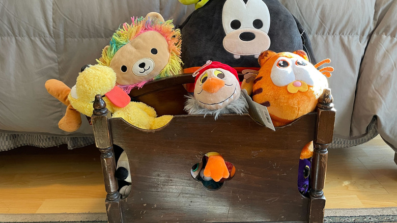 stuffed animals in a magazine rack