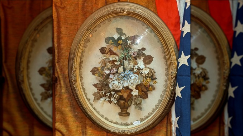 Shadowbox oval frame with flowers