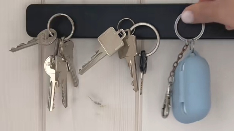 Series of car keys sticking to an IKEA magnetic knife holder